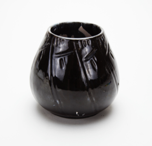 Image of Vase, Black with Shallow Oblique Carvings of Symbolic Imagery